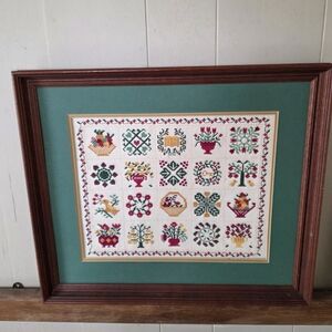 Framed Cross Stitch Sampler with Floral and Folk Art Motifs